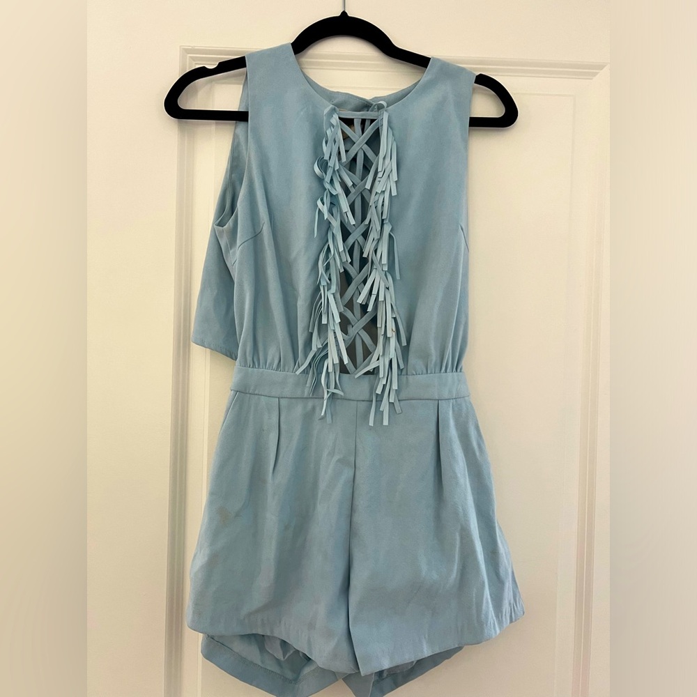 Size small light blue velvet like romper with fringe and open cutout in front